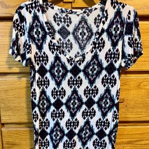 Purple, white & black design on v-neck shirt (small)